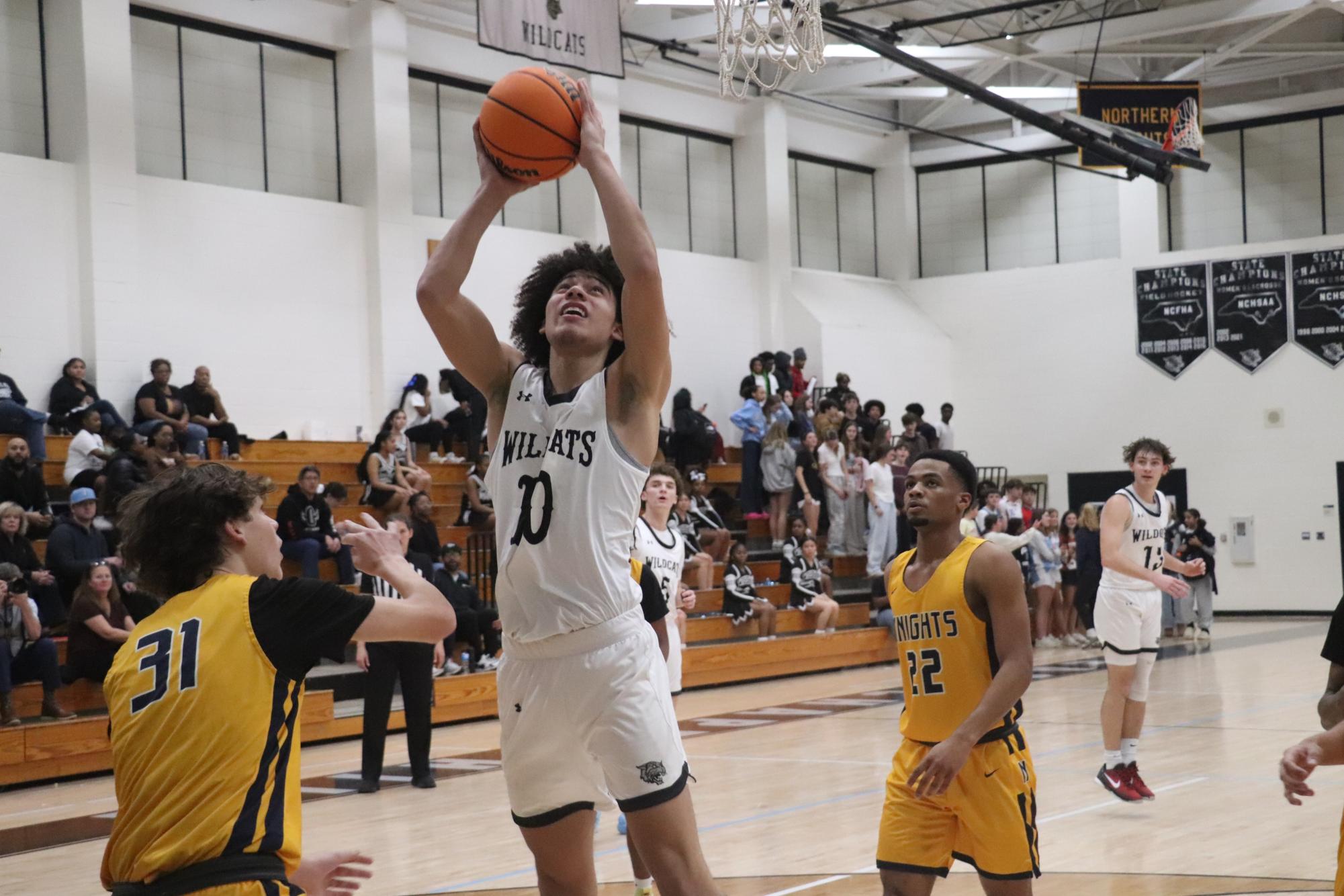 Joe Basketball drives to the hoop in East's 100-27 victory.
