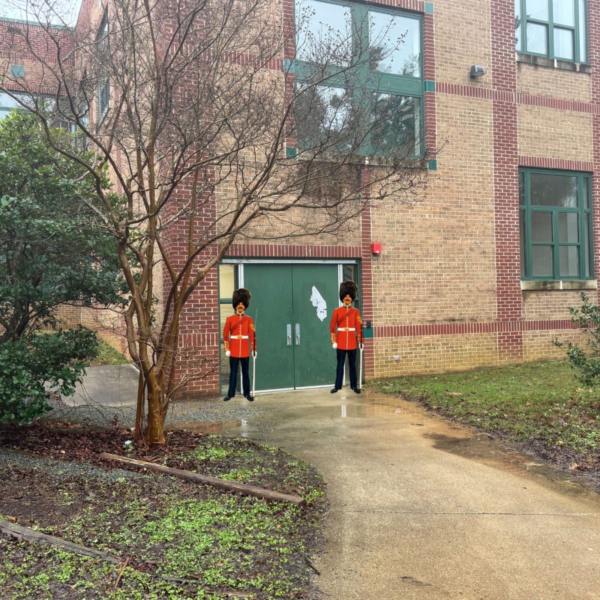 Two sentries stare unseeing outside Quad A doors.
