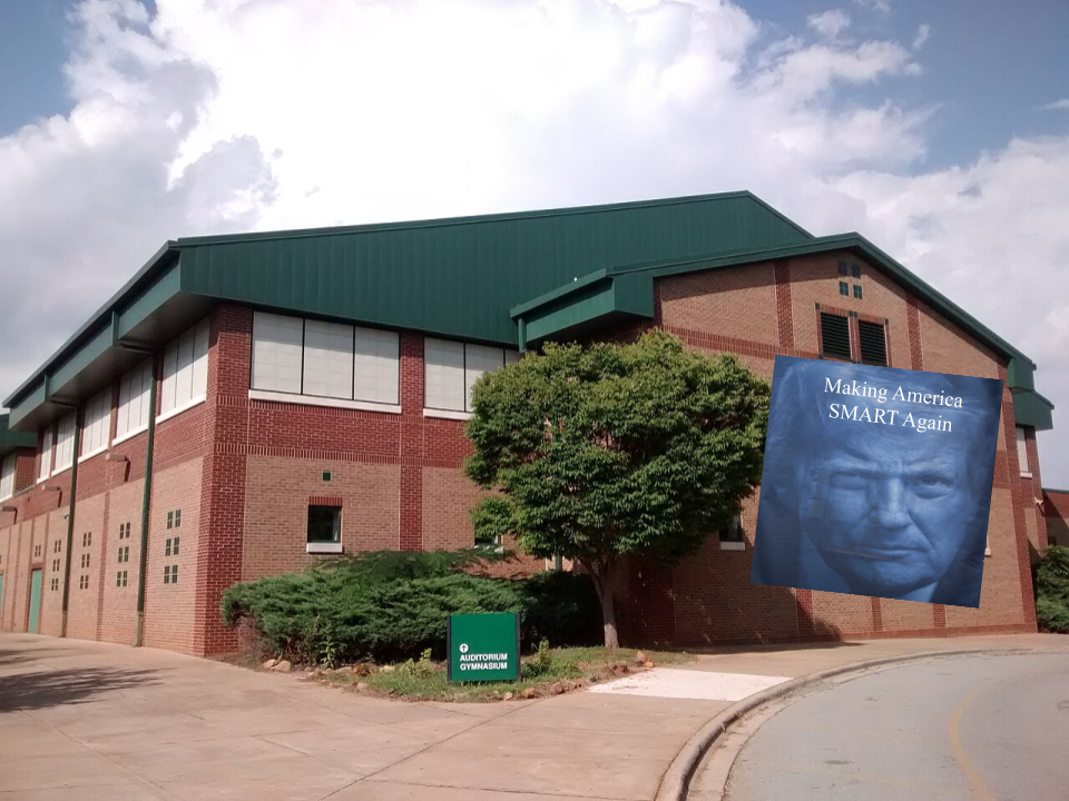One of many more to come, Trump's banner placed on the school's outer wall overlooking the carpool lane.