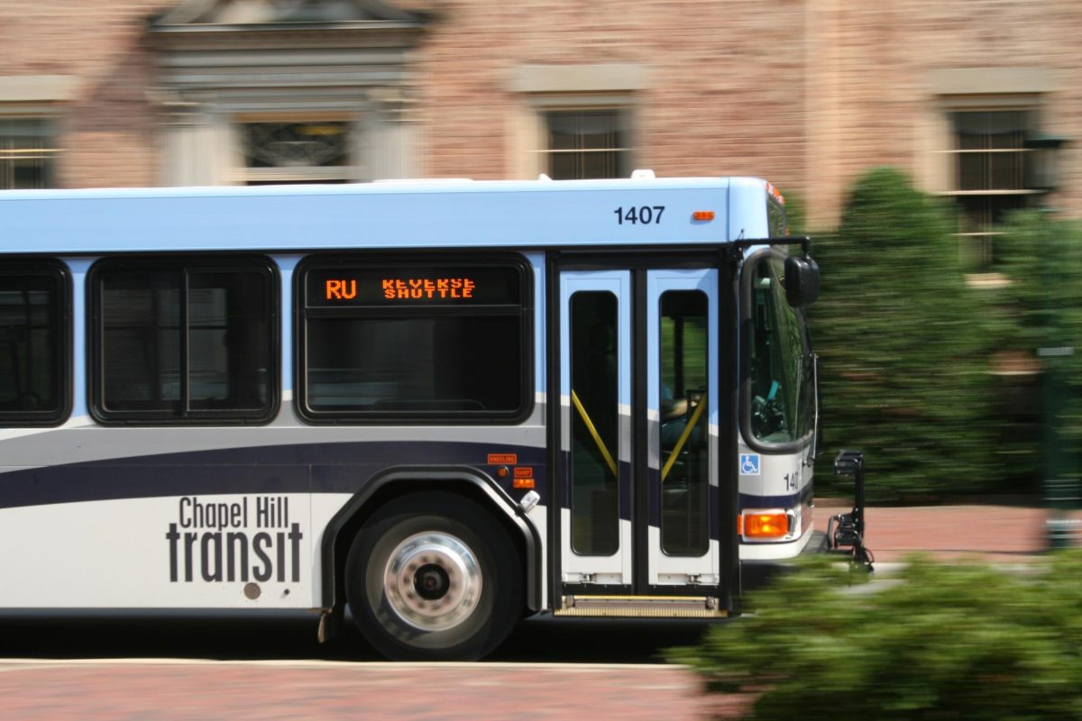 A Chapel Hill Transit bus passing South Building on Cameron Ave at the University of North Carolina at Chapel Hill.